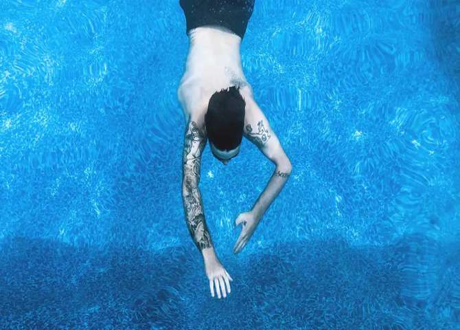 swim with a new tattoo